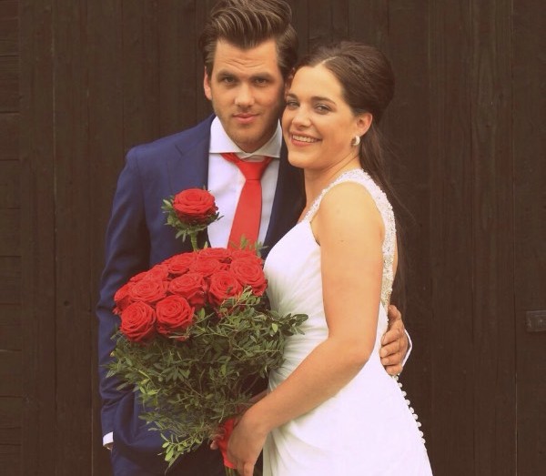 Newly weds with Porta Nova Red Noami bridal bouquet
